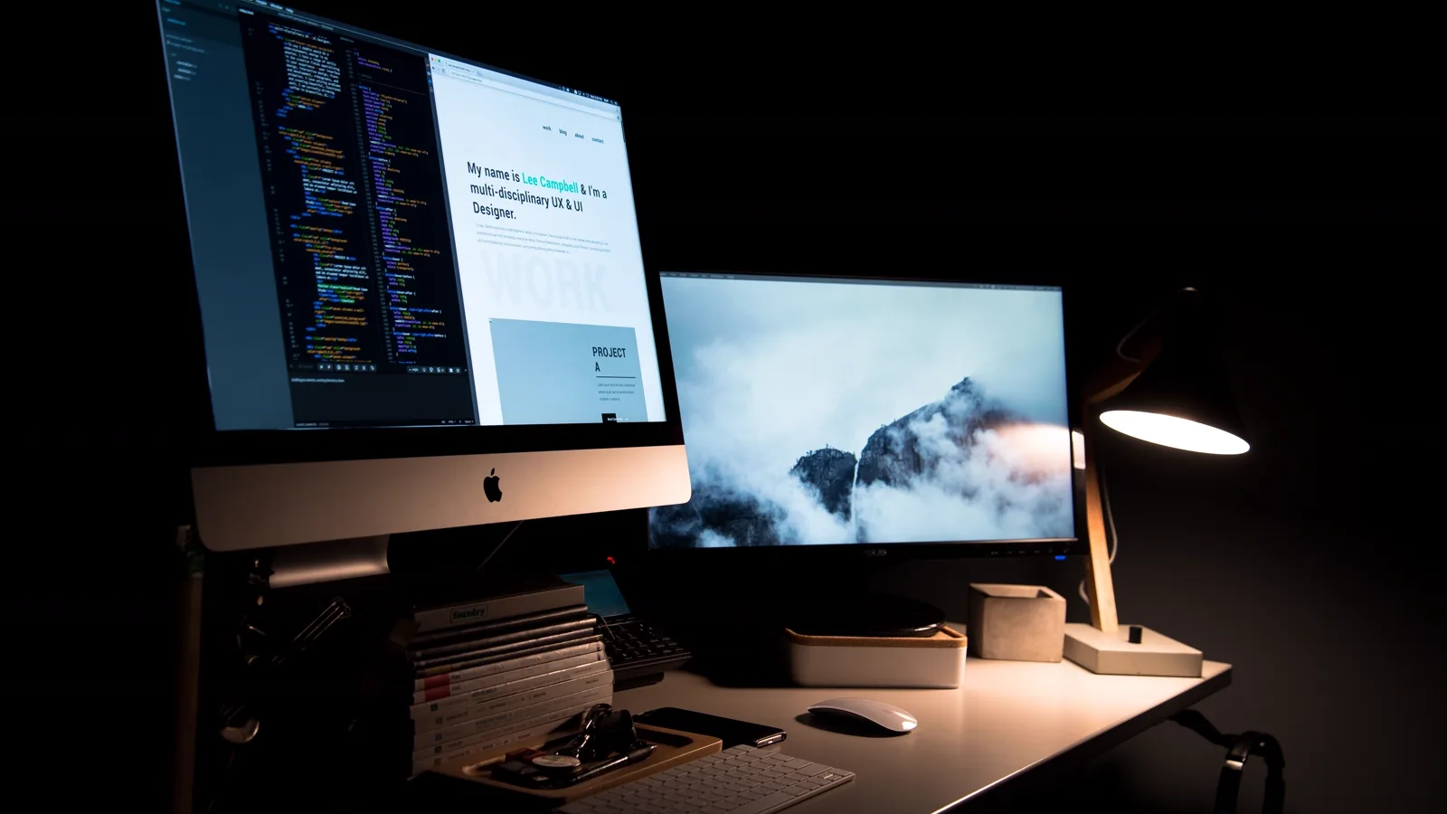 Dual-monitor desk setup used to compare display resolution, workspace, and text clarity